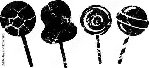 Silhouette set of various lollipops with different shapes and spiral patterns on sticks