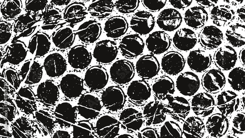 Close up textured pattern of black and white bubble wrap plastic packaging surface