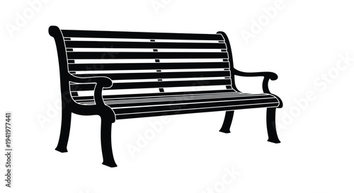 A black park bench viewed from the side in silhouette