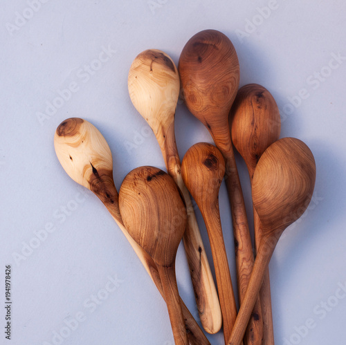 Wooden kitchen utensils stacked view closeup