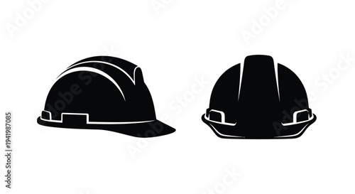 Two black construction helmets displayed against a white background silhouette