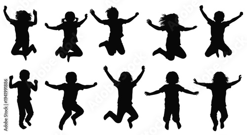 Joyful children jumping and playing a dark silhouette