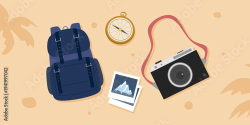 Adventure photographer gear flat lay with backpack and mountain photo