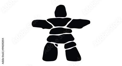 Stacked stones forming a human like figure black silhouette