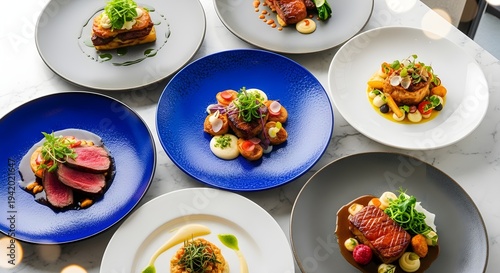 Seven plates of gourmet food on a table