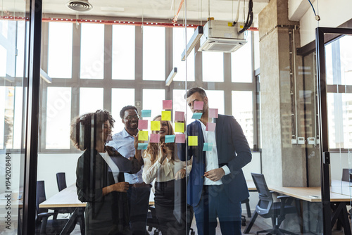 Diverse Business Team Brainstorming With Sticky Notes During Creative Office Meeting