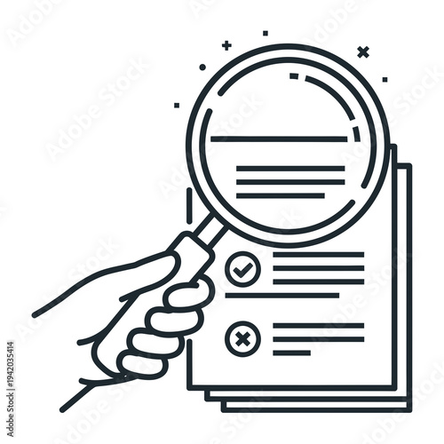 Hand holding magnifying glass over document.