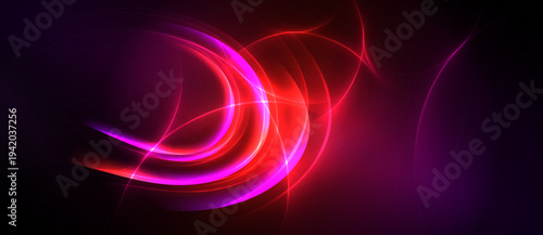 Abstract vibrant light streaks. Swirling shapes dominate dark background. Intense colors create dynamic visual effect.