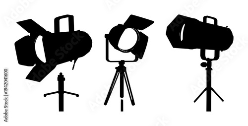 Spotlights set with solid black silhouette of a vintage theatrical spotlight on a stand featuring film noir, precise edges, white background with black silhouette and spotlight