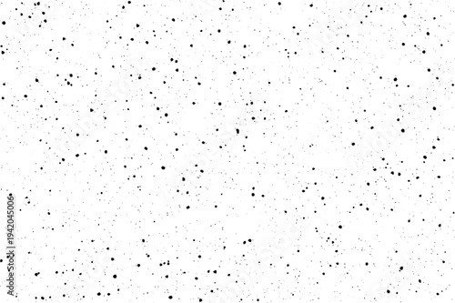 A dense array of small black dots creates a vintage film grain appearance on a clean white surface