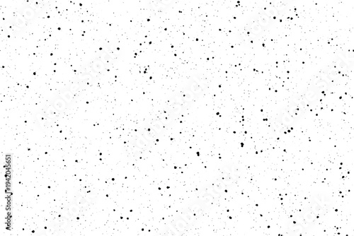 A distinctive visual effect created by many small black dots spread irregularly over white