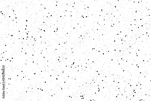 A monochromatic scattered dot pattern creates a speckled effect on a clean white surface