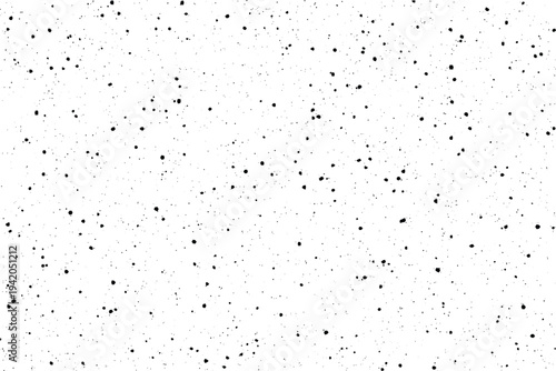 A versatile distressed texture featuring a random distribution of small black specks across a bright white surface