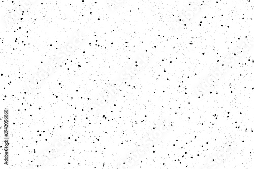 Many small black elements are randomly dispersed over a clean bright surface for a unique effect