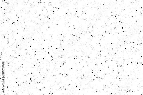 Minimalist design featuring numerous small black flecks on a crisp white background