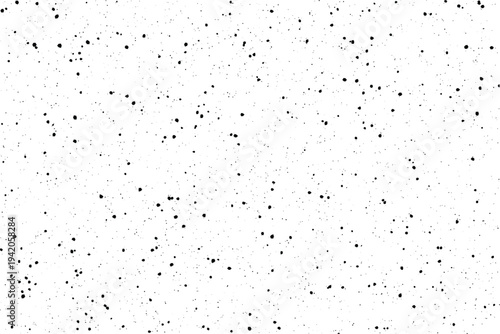 Numerous tiny black flecks are randomly dispersed across a pristine white canvas background