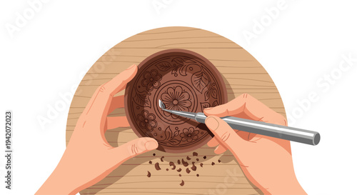 Two hands meticulously carve an intricate floral and circular pattern into a dark brown clay bowl using a metal carving tool.