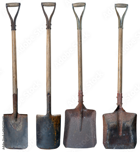 Old shovel and spade covered with rust on an isolated background.