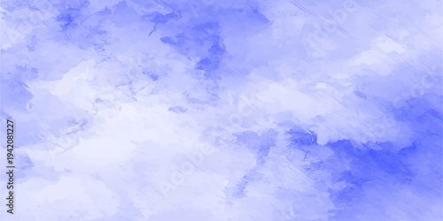 A beautiful view of fluffy white clouds in a bright blue summer sky with sunny light and a clear atmosphere