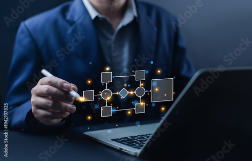 Business professional designing digital workflow diagram on laptop, representing business process management, automation system, project planning, and corporate digital transformation concept.