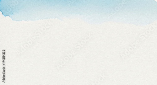 Soft light blue watercolor wash on textured white paper with a rough edge Keywords: watercolor, wash, blue, light blue, white, paper, textured, background, abstract, art, painting