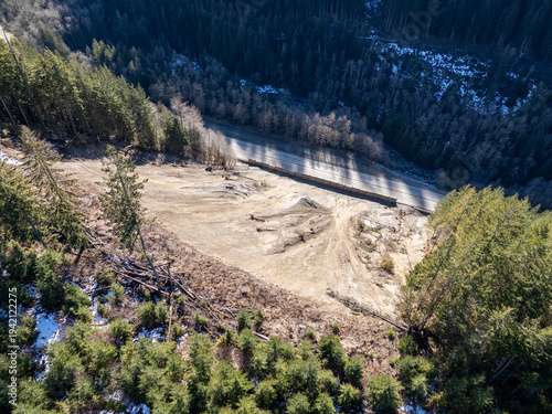Aerial View Of Landslide Damage Beside Mountain Road Through Forest In BC Canada