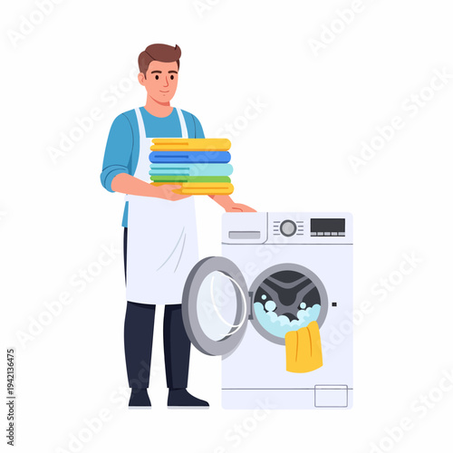 Man doing laundry, holding clean folded towels next to a washing machine with a yellow towel inside.