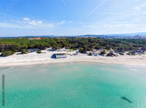 Fotografía Aerial view of Maria Pia beach sandy shore seen from the water on a sunny mornin