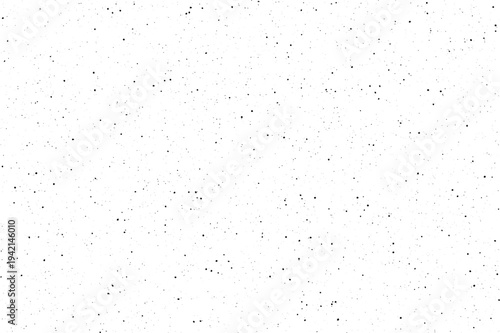 White surface covered uniformly with tiny black dots creating a subtle noise effect