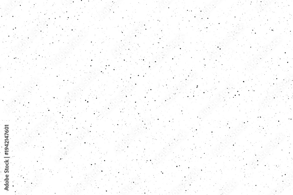 Fototapeta premium Scattered black dots creating a distressed grainy pattern on a clean white surface