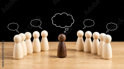Sad person surrounded by happy people with thought bubbles