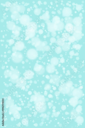 Soft Mint Blue Winter Snowfall Bokeh Background for Holiday Cards and Festive Designs