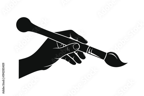 A black silhouette of a hand holding a paintbrush, symbolizing creativity and artistry in a minimalist design.
