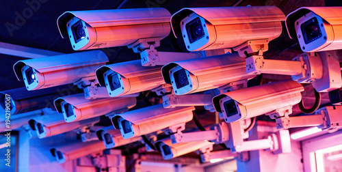 Multiple Security Cameras Installed on a Ceiling with Blue and Red Lighting Effects