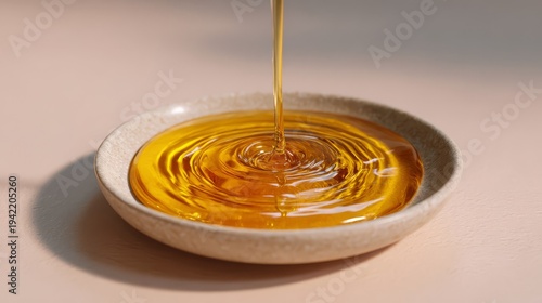 Golden Honey Pouring into a Delicate Porcelain Dish