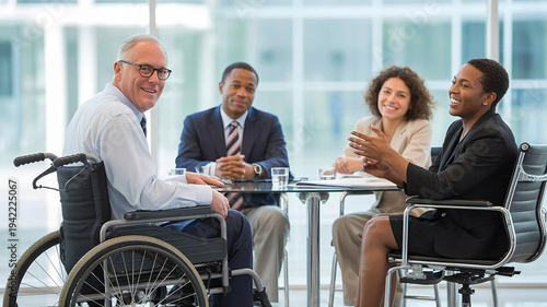 Inclusive diverse business team meeting with wheelchair user in office
