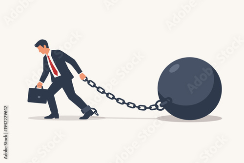 Businessman in a suit chained to a large heavy ball and chain representing debt, taxes, and financial burden. Concept of business struggle, economic pressure, and being held back by obligations.
