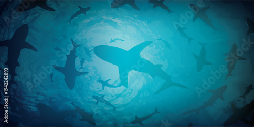 Silhouettes of sharks swimming in a dark blue ocean.