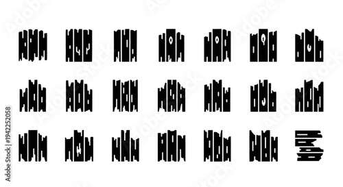 A collection of abstract black silhouettes arranged in a grid pattern on a plain surface viewed from directly above