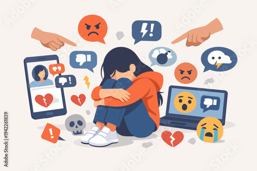 Sad young girl sitting alone and feeling depressed while being cyberbullied on social media networks with negative comments, hateful emojis, and online harassment on her smartphone and laptop.