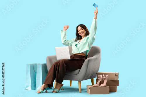 Happy young woman with lapt...