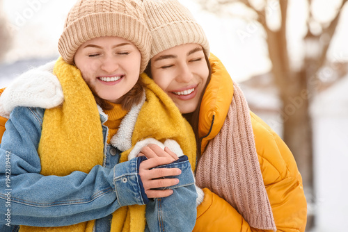 Female friends hugging at s...