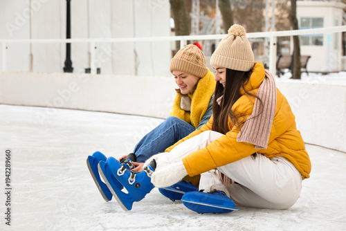 Female friends in ice skate...