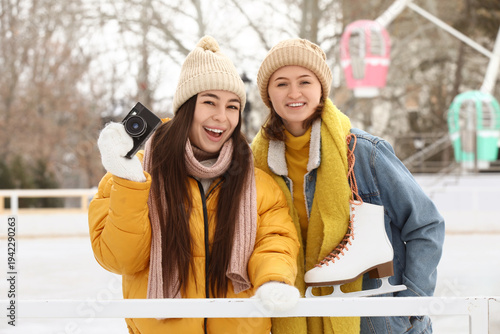 Female friends with photo c...