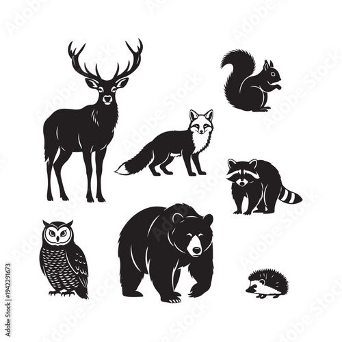 Vector illustration of a wild animals silhouette set featuring a deer, stag, and elephant among fauna icons in black nature style