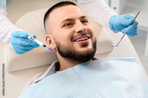 Young man visiting dentist ...