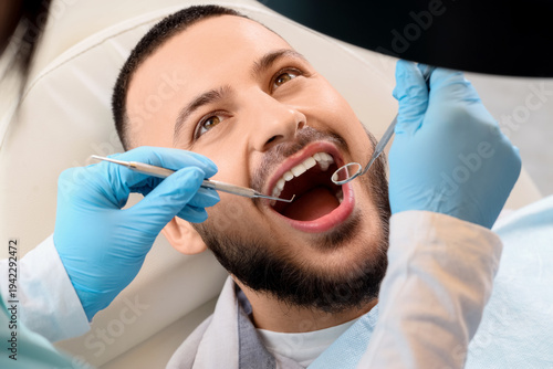 Young man visiting dentist ...