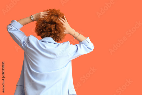 Redhead young woman with cu...