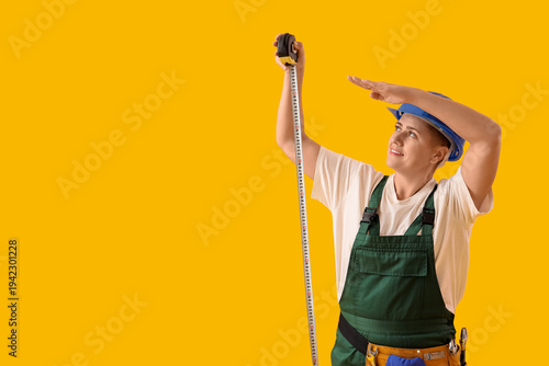 Female worker with tape mea...