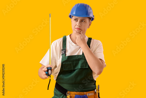 Thoughtful female worker wi...